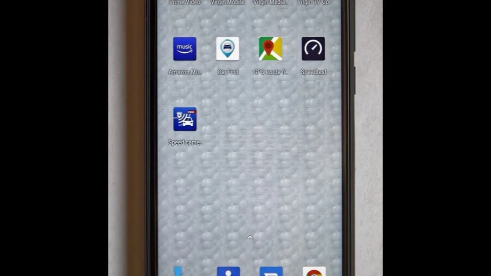 Android smartphone with its home screen showing apps